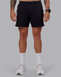 Man wearing Lift Lined 6" Short in Black-Reflective | Size:M | Thumbnail Index: 0