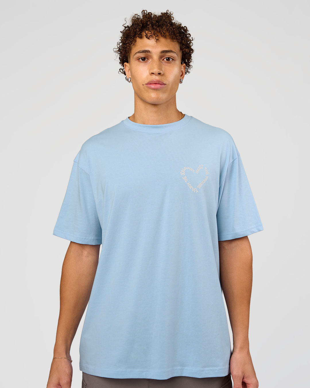 Man wearing Love The Process FLXCotton Oversize Tee - Open Air-Off White | Model:Leandro | Size:M - view 3
