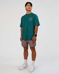 Man wearing Love The Process FLXCotton Oversize Tee - Transformative Teal-Marshmallow | Model:George | Size:M | Thumbnail Index: 5