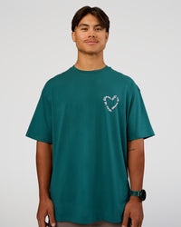 Man wearing Love The Process FLXCotton Oversize Tee - Transformative Teal-Marshmallow | Model:George | Size:M | Thumbnail Index: 2