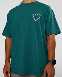 Man wearing Love The Process FLXCotton Oversize Tee - Transformative Teal-Marshmallow | Model:George | Size:M | Thumbnail Index: 8