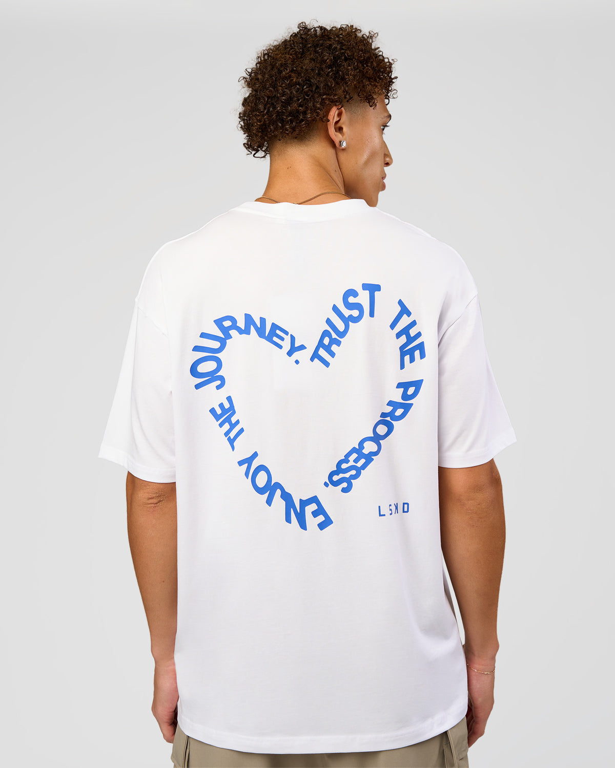 Man wearing Love The Process FLXCotton Oversize Tee - White-Electric Indigo | Model:Leandro | Size:M