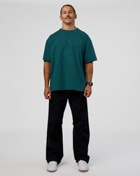 Man wearing MVP 2.0 Oversized Tee - Transformative Teal | Model:Jaiden | Size:M | Thumbnail Index: 7