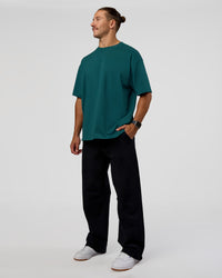 Man wearing MVP 2.0 Oversized Tee - Transformative Teal | Model:Jaiden | Size:M | Thumbnail Index: 2