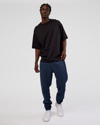 Man wearing MVP Cuffed Track Pant - Future Navy | Model:Okello | Size:M | Thumbnail Index: 4