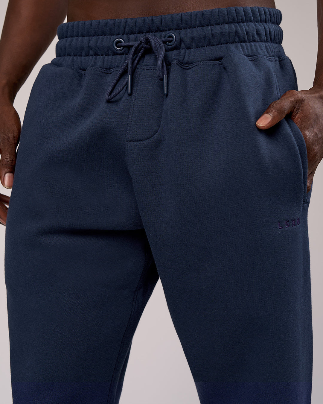 Man wearing MVP Cuffed Track Pant - Future Navy | Model:Okello | Size:M - view 3