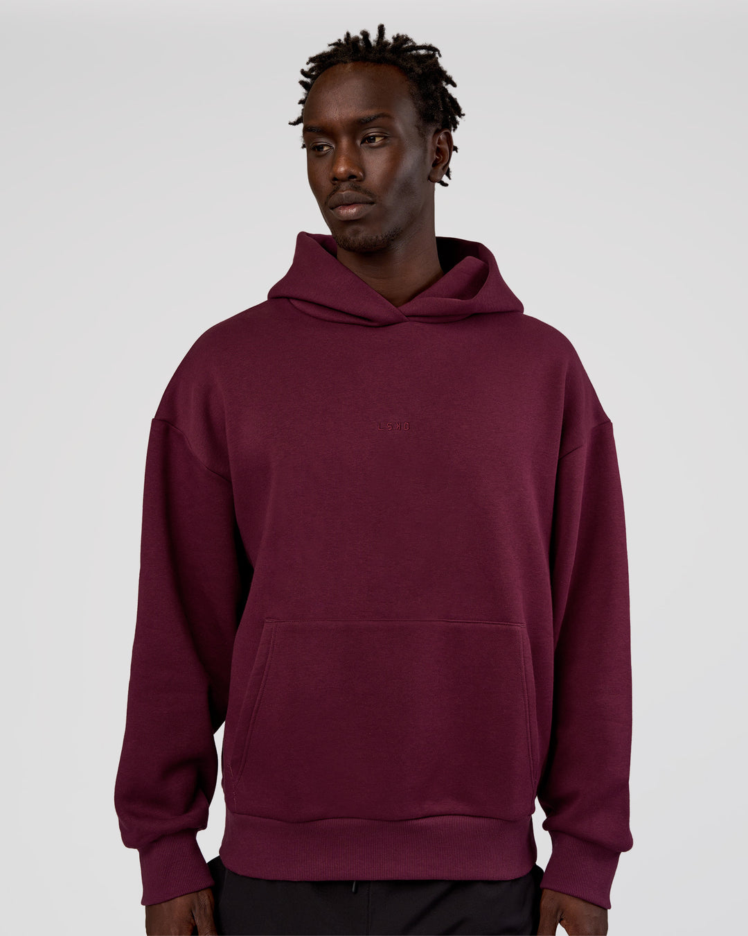 Man wearing MVP Oversized Hoodie - Cherry Lacquer | Model:Okello | Size:M - view 4