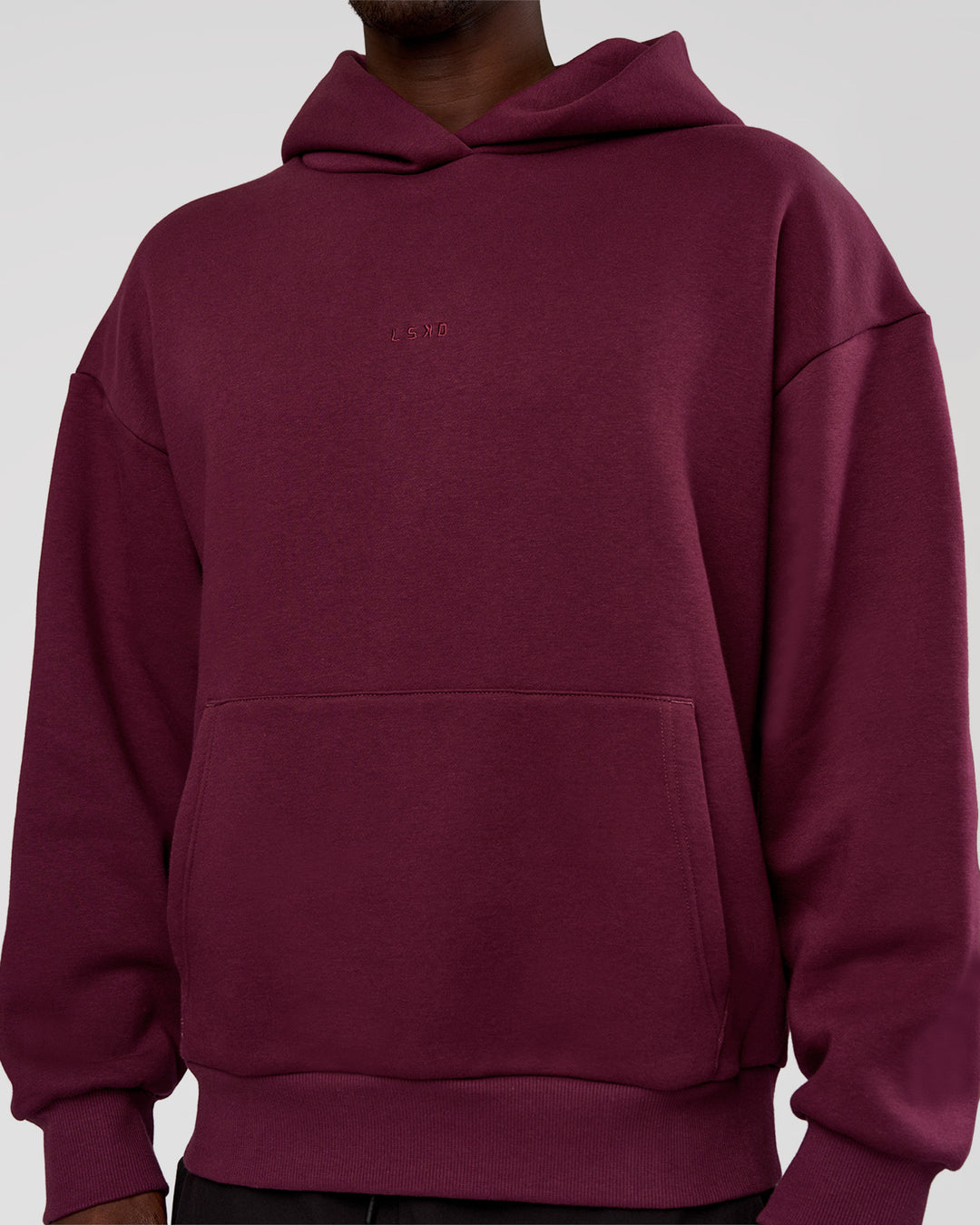 Man wearing MVP Oversized Hoodie - Cherry Lacquer | Model:Okello | Size:M - view 10