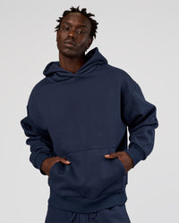 Man wearing MVP Oversized Hoodie - Future Navy | Model:Okello | Size:M | Thumbnail Index: 1