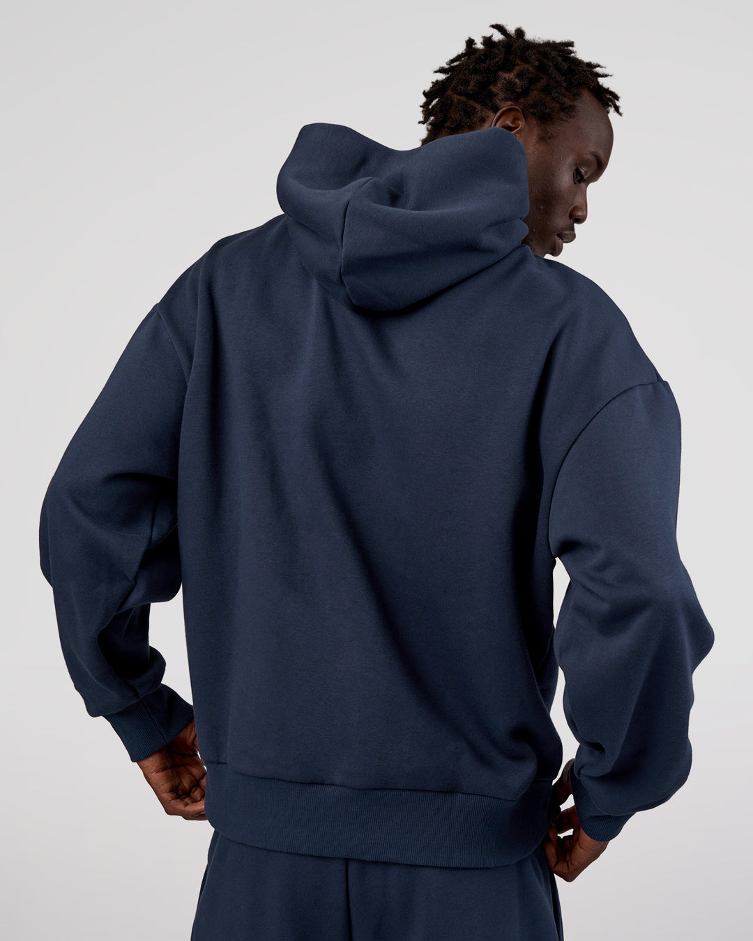 Man wearing MVP Oversized Hoodie - Future Navy | Model:Okello | Size:M - view 3