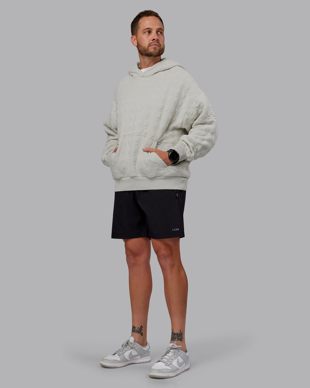 Man wearing MVP Quilted Oversized Hoodie in Digital Mist-Geometric | Model:Macca | Size:M - view 12