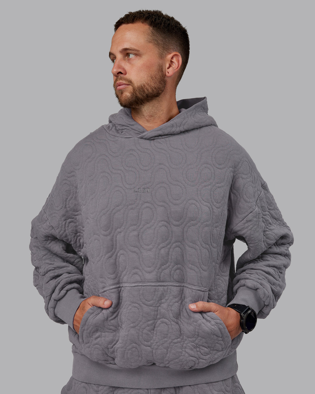 Man wearing MVP Quilted Oversized Hoodie - Storm Front-Geometric | Model:Macca | Size:M - view 7