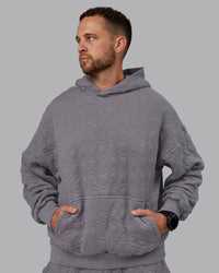 Man wearing MVP Quilted Oversized Hoodie - Storm Front-Geometric | Model:Macca | Size:M | Thumbnail Index: 6