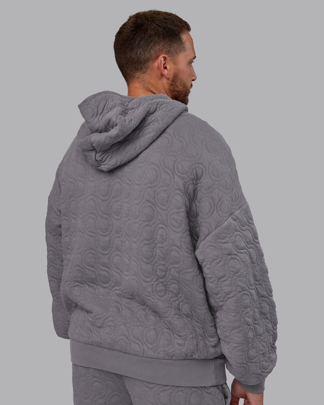 Man wearing MVP Quilted Oversized Hoodie - Storm Front-Geometric | Model:Macca | Size:M - view 4