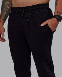 Man wearing MVP Quilted Track Pant - Black-Geometric | Model:Macca | SIze:M | Thumbnail Index: 2