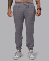 Man wearing MVP Quilted Track Pant - Storm Front-Geometric | Model:Macca | Size:M | Thumbnail Index: 0