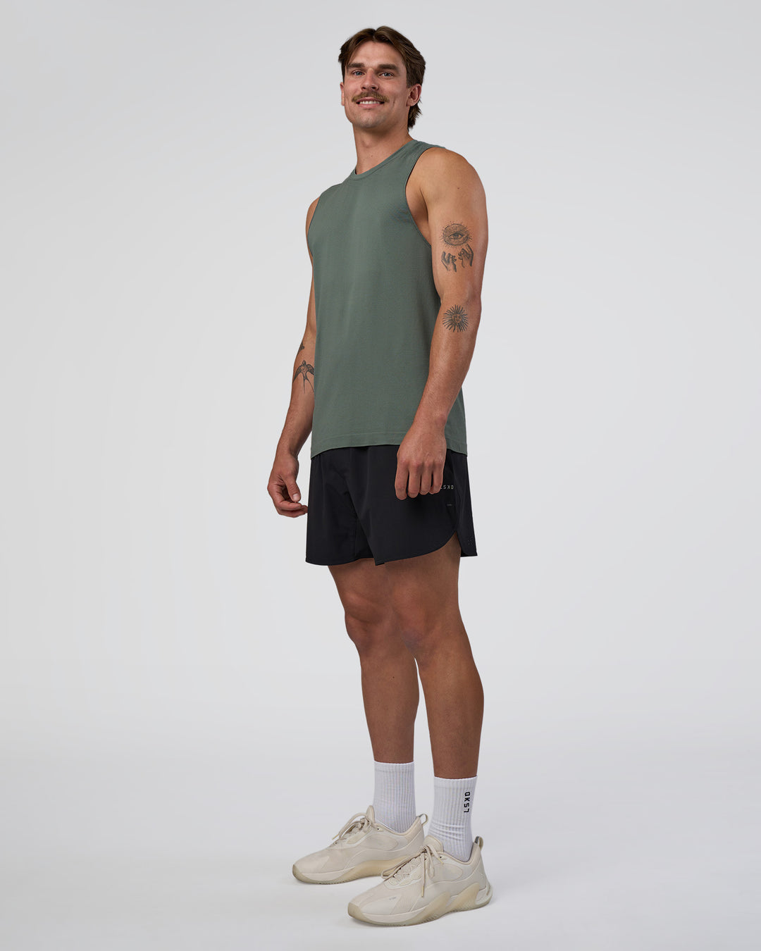 Man wearing AeroFLX+ Seamless Muscle Tank - Graphite/Graphite | Model:Konnor | Size:M - view 2