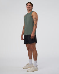 Man wearing AeroFLX+ Seamless Muscle Tank - Graphite/Graphite | Model:Konnor | Size:M | Thumbnail Index: 1