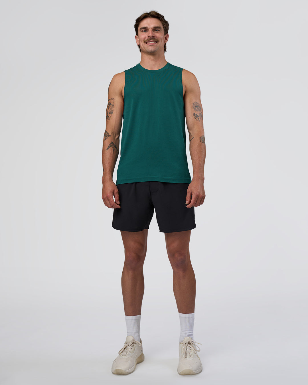 Man wearing AeroFLX+ Seamless Muscle Tank - Transformative Teal/Transformative Teal | Model:Konnor | Size:M - view 2