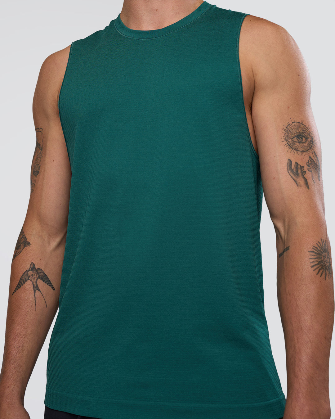 Man wearing AeroFLX+ Seamless Muscle Tank - Transformative Teal/Transformative Teal | Model:Konnor | Size:M - view 5