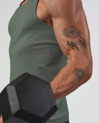 Man wearing AeroFLX+ Seamless Tank - Graphite/Graphite | Model:Konnor | Size:M | Thumbnail Index: 1