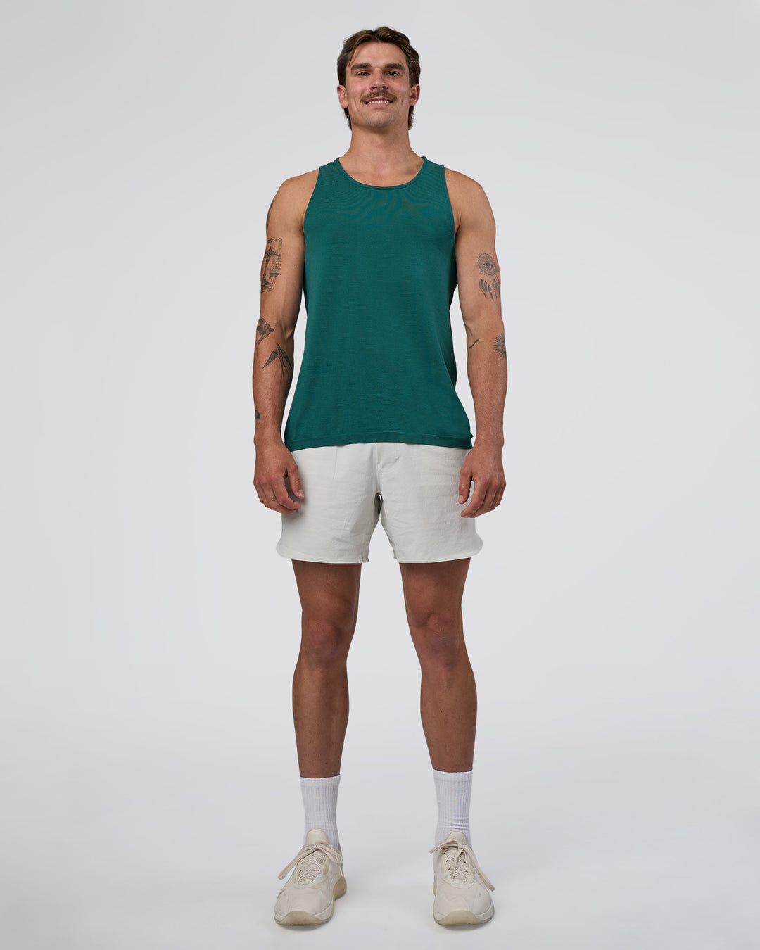 Man wearing AeroFLX+ Seamless Tank - Transformative Teal/Transformative Teal | Model:Konnor | Size:M - view 5