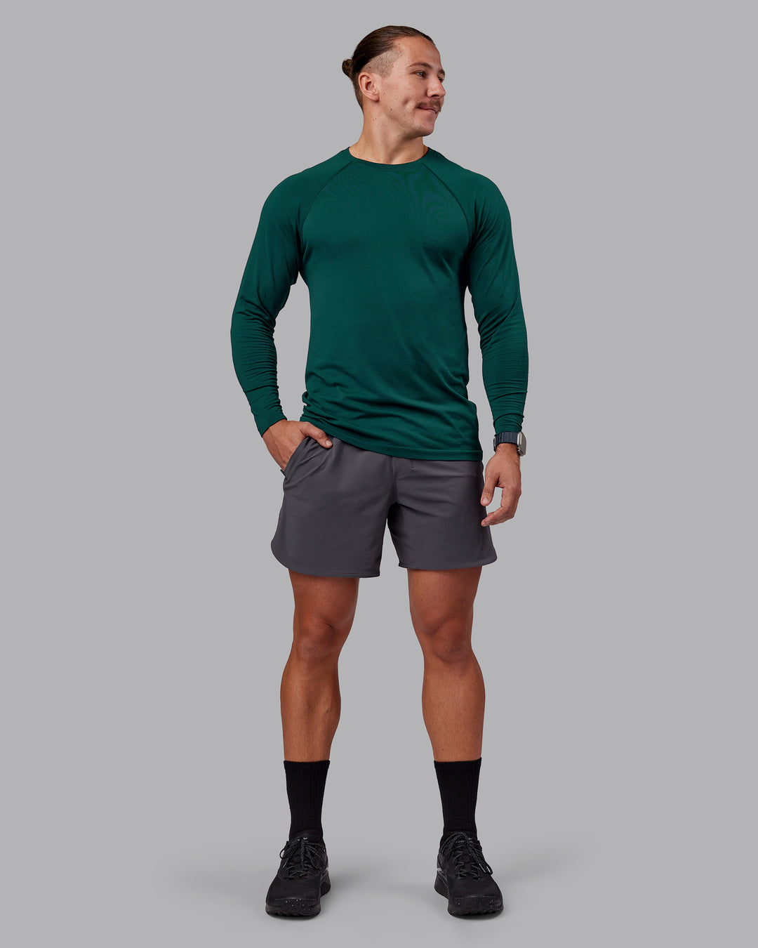 Man wearing AeroFLX+ Seamless Long Sleeve Tee - Dark Moss/Dark Moss | Model:Jaiden | Size:M - view 4