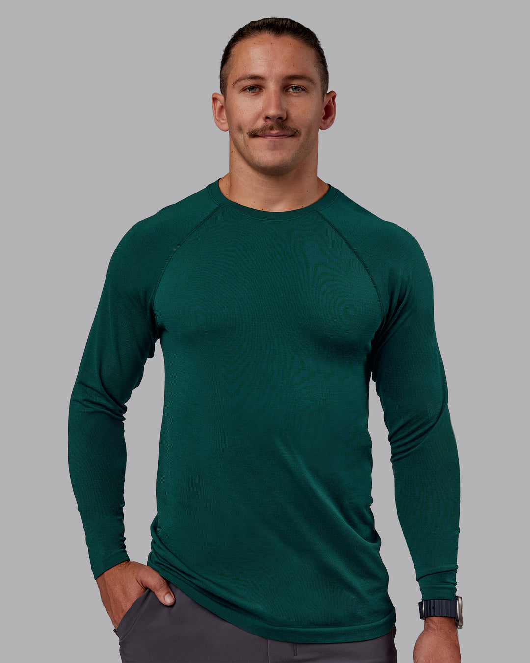 Man wearing AeroFLX+ Seamless Long Sleeve Tee - Dark Moss/Dark Moss | Model:Jaiden | Size:M - view 2