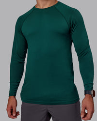 Man wearing AeroFLX+ Seamless Long Sleeve Tee - Dark Moss/Dark Moss | Model:Jaiden | Size:M | Thumbnail Index: 4