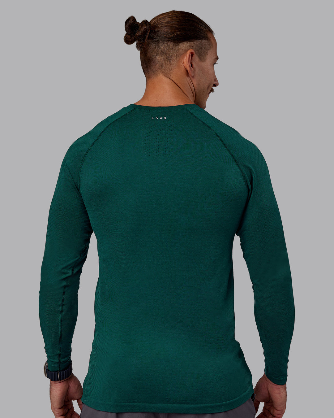 Man wearing AeroFLX+ Seamless Long Sleeve Tee - Dark Moss/Dark Moss | Model:Jaiden | Size:M - view 3