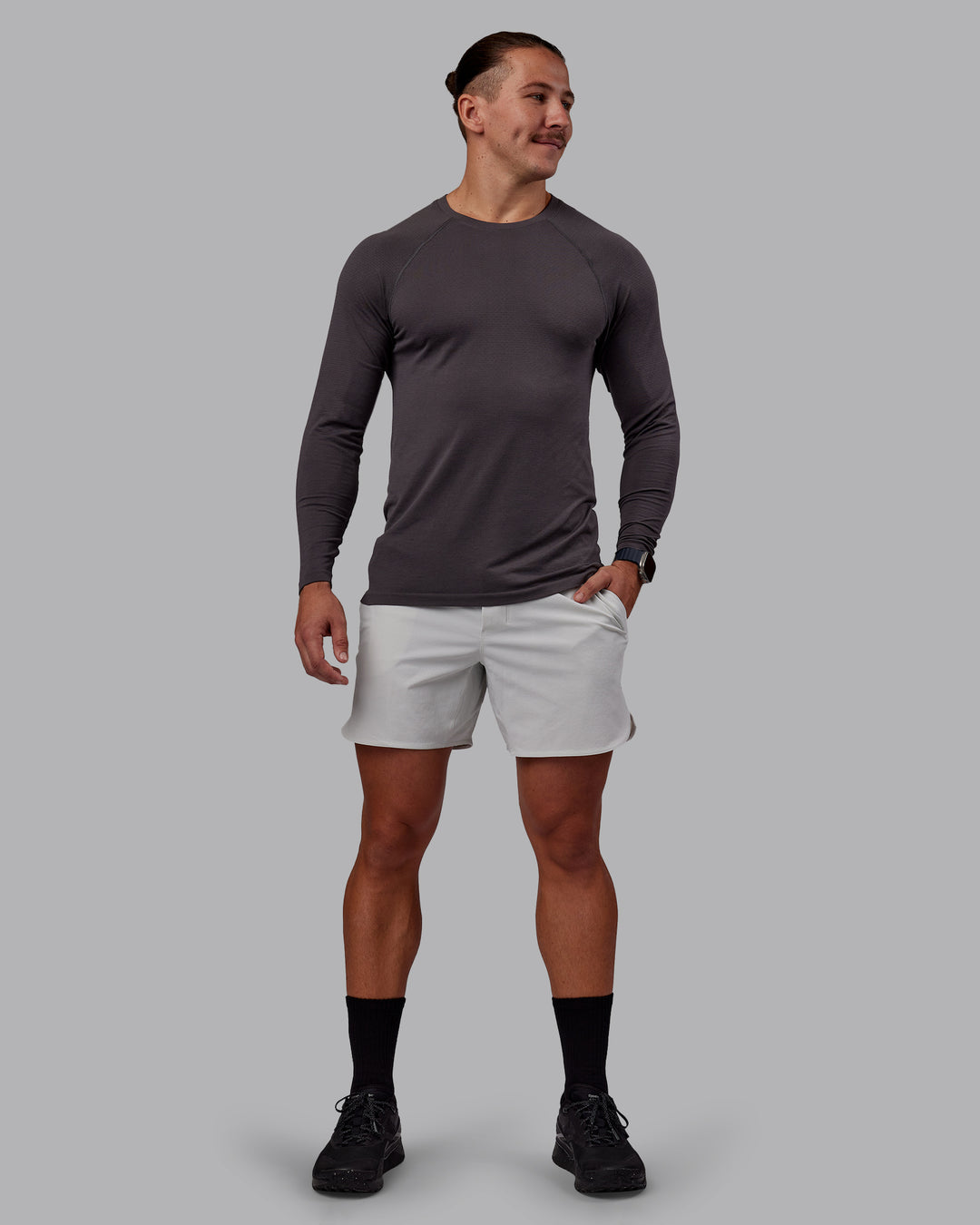 Man wearing AeroFLX+ Seamless Long Sleeve Tee - Dark Storm/Dark Storm | Model:Jaiden | Size:M - view 4