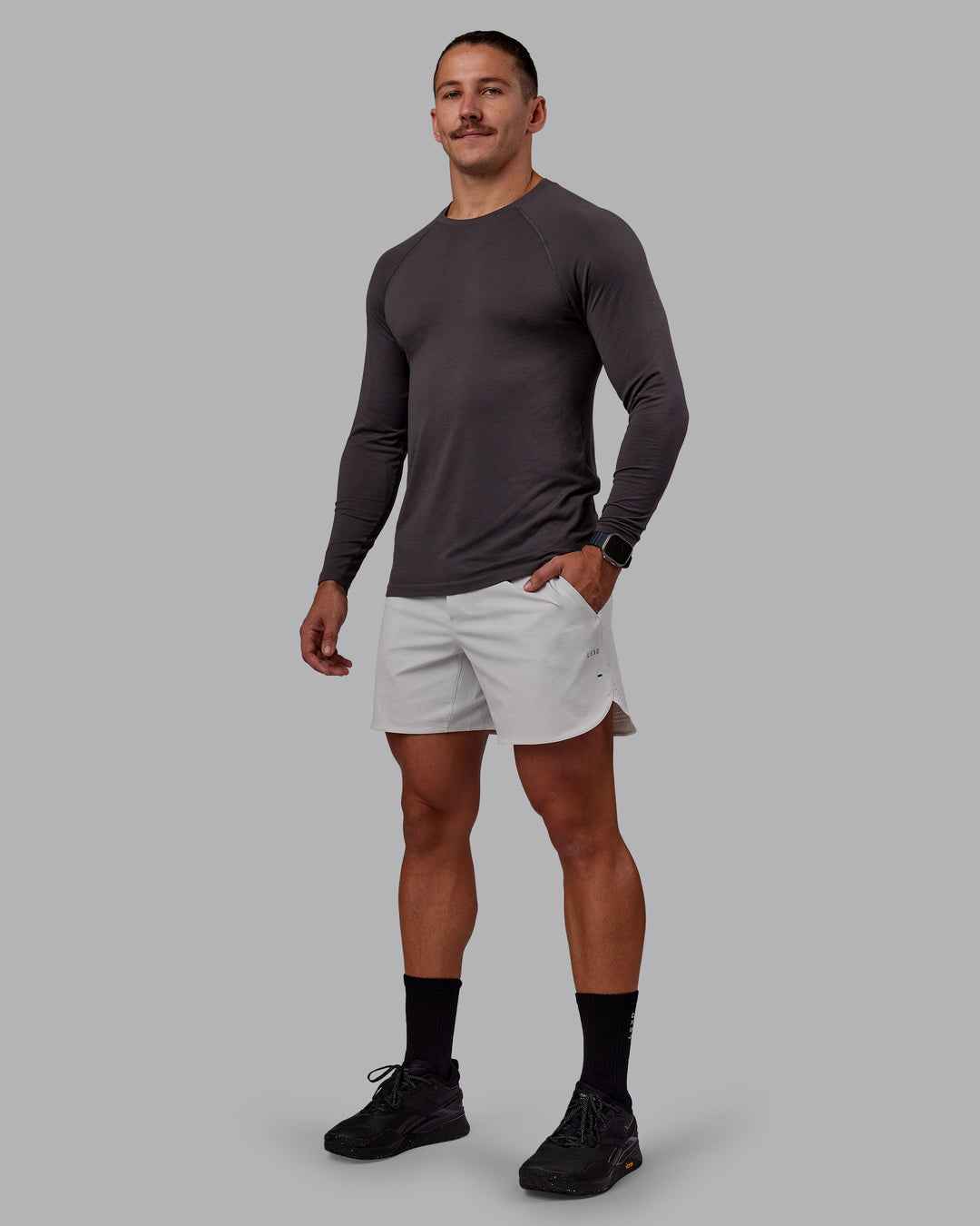 Man wearing AeroFLX+ Seamless Long Sleeve Tee - Dark Storm/Dark Storm | Model:Jaiden | Size:M - view 2