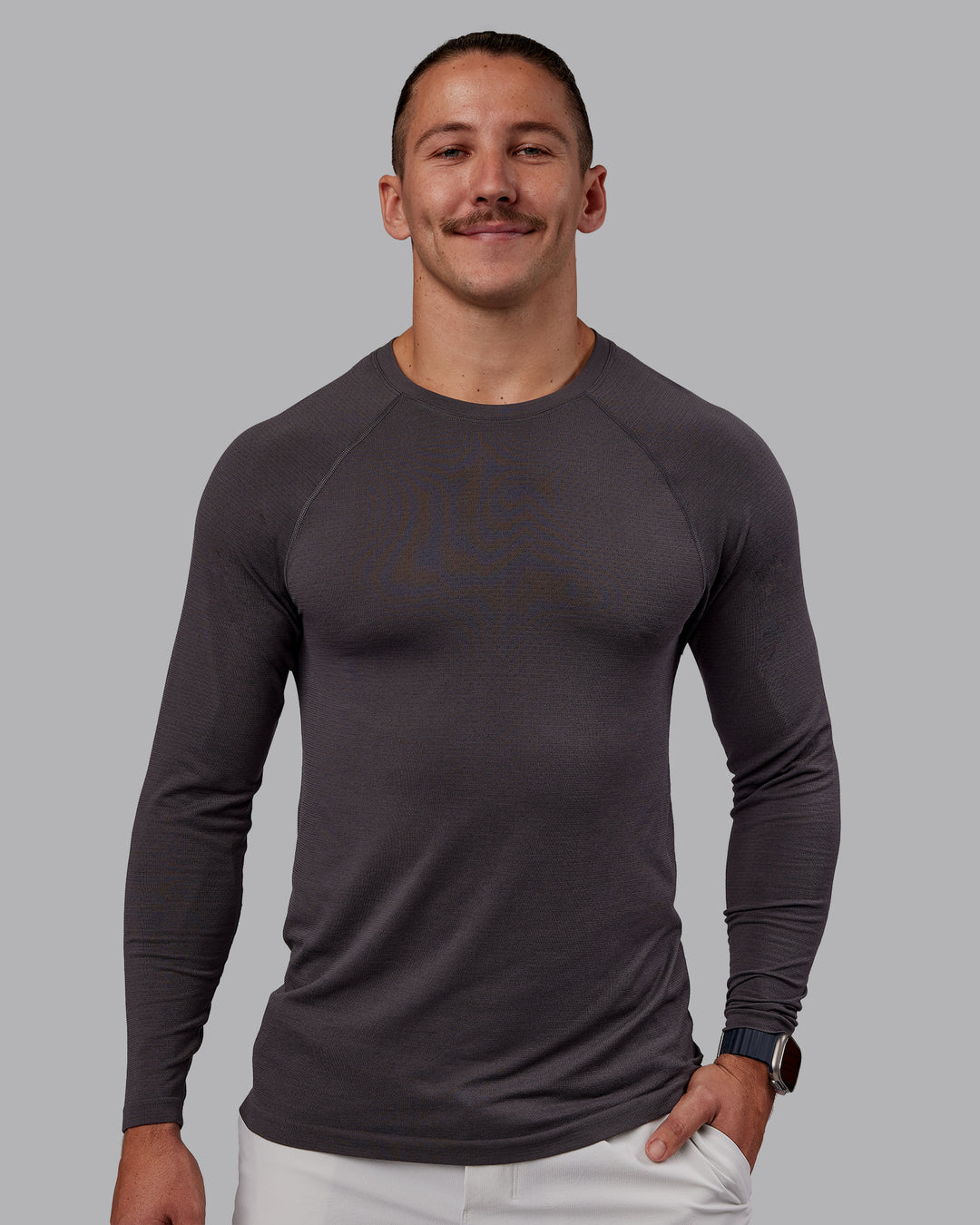 Man wearing AeroFLX+ Seamless Long Sleeve Tee - Dark Storm/Dark Storm | Model:Jaiden | Size:M - view 1