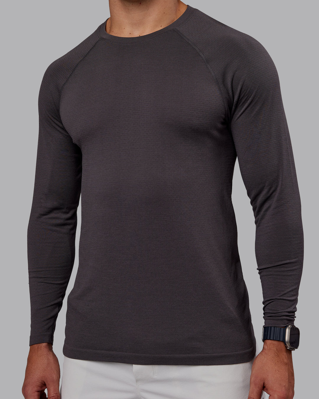 Man wearing AeroFLX+ Seamless Long Sleeve Tee - Dark Storm/Dark Storm | Model:Jaiden | Size:M - view 5