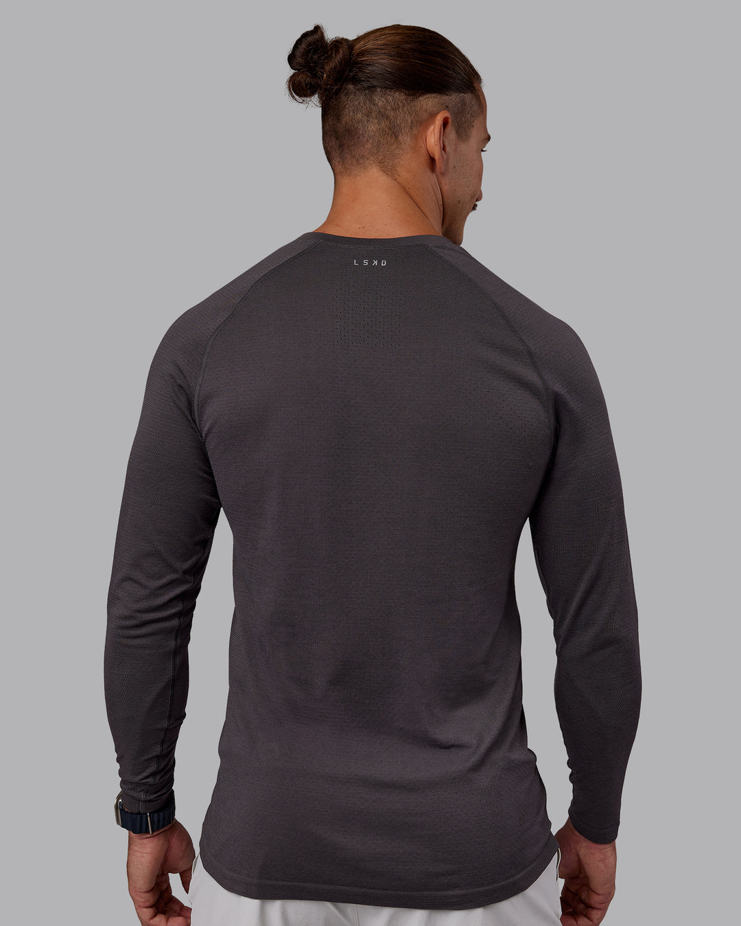 Man wearing AeroFLX+ Seamless Long Sleeve Tee - Dark Storm/Dark Storm | Model:Jaiden | Size:M - view 3