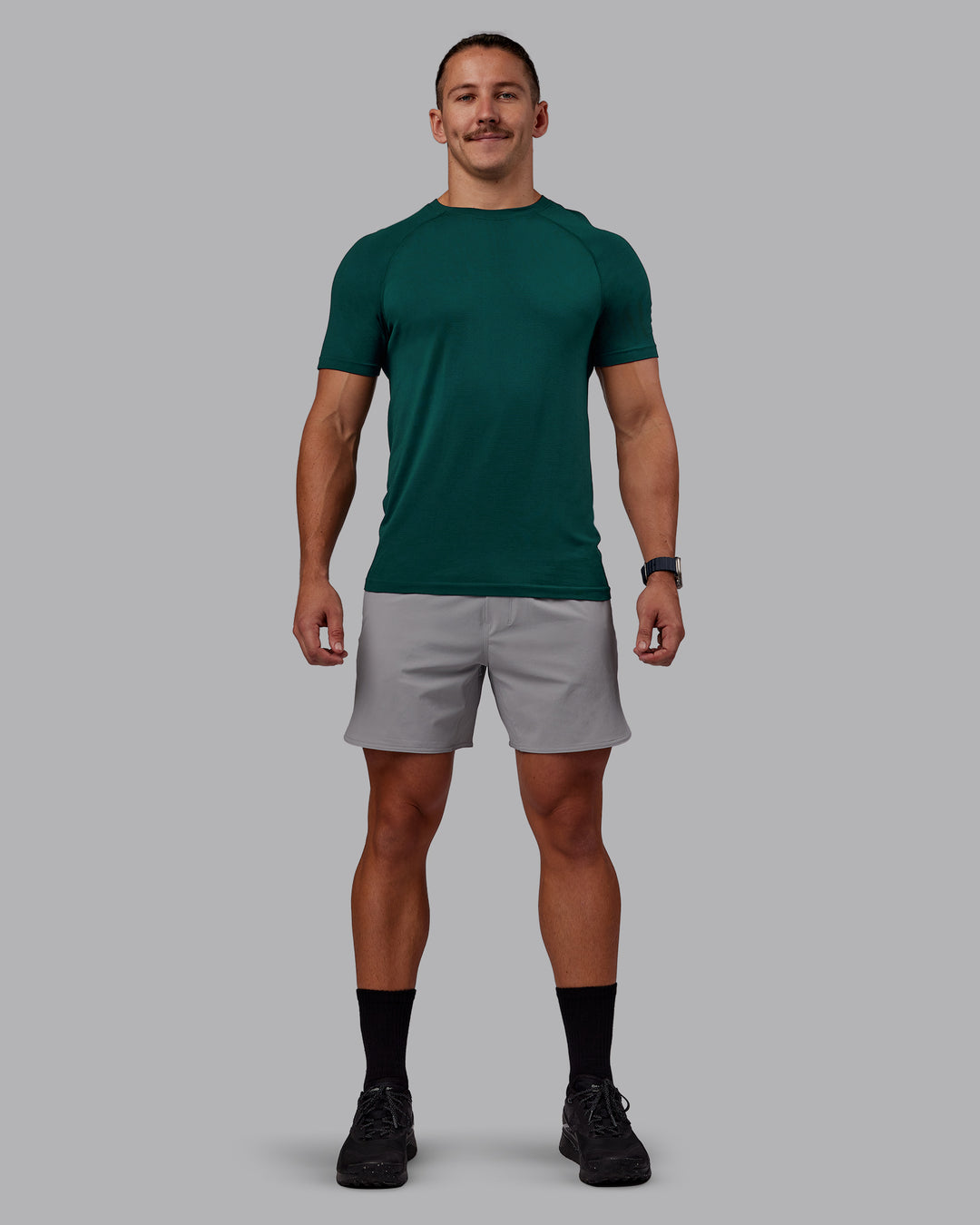 Man wearing AeroFLX+ Seamless Tee - Dark Moss/Dark Moss | Model:Jaiden | Size:M - view 5