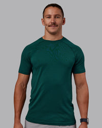 Man wearing AeroFLX+ Seamless Tee - Dark Moss/Dark Moss | Model:Jaiden | Size:M | Thumbnail Index: 0