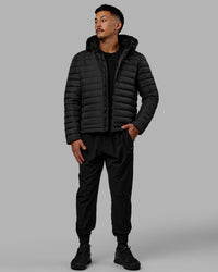 Man wearing All-day Puffer Jacket - Black | Thumbnail Index: 9