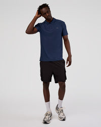 Man wearing Drive Polo - Future Navy | Model:Okello | Size:M | Thumbnail Index: 1