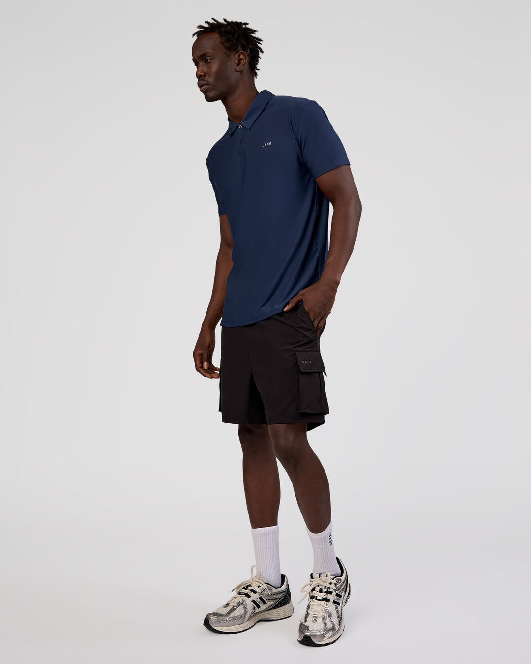 Man wearing Drive Polo - Future Navy | Model:Okello | Size:M - view 5