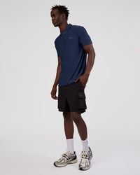 Man wearing Drive Polo - Future Navy | Model:Okello | Size:M | Thumbnail Index: 4
