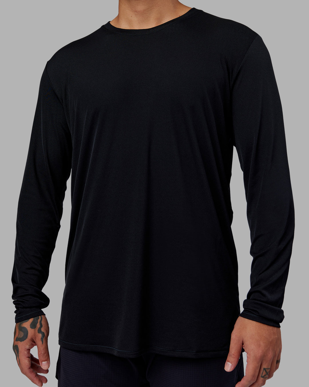 Man wearing Pace Running Long Sleeve Top - Black | Model:Justin | Size:M - view 5