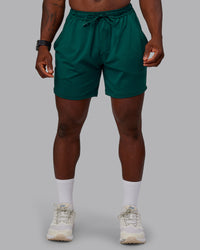 Man wearing Restore CloudFLX Short in Dark Moss | Size:M | Model:Sam | Thumbnail Index: 0