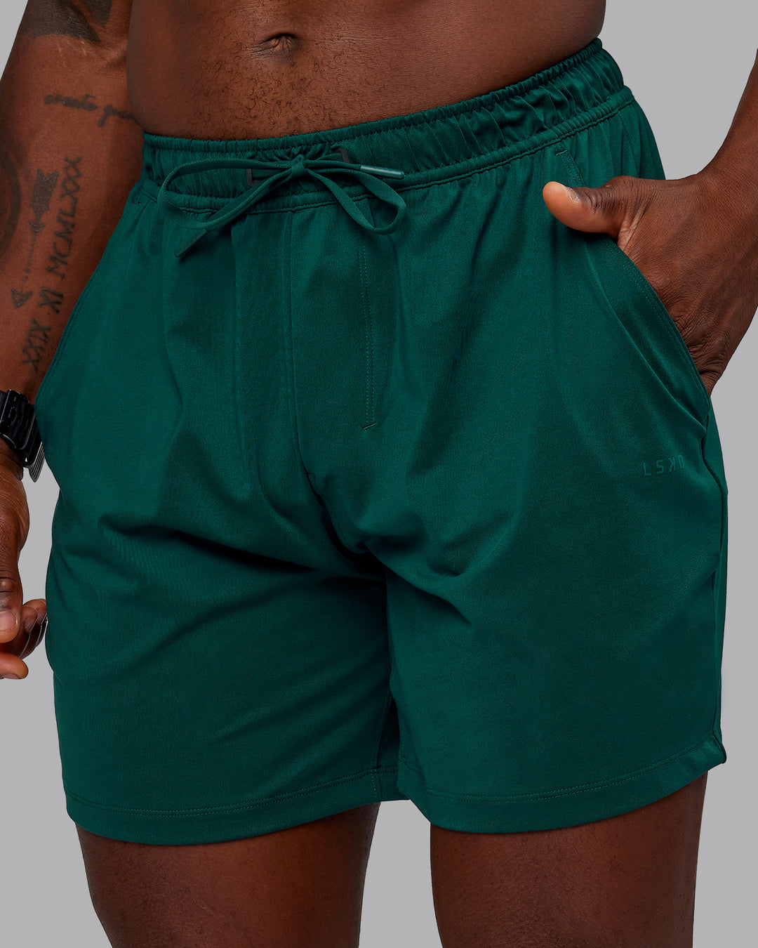 Man wearing Restore CloudFLX Short in Dark Moss | Size:M | Model:Sam - view 3