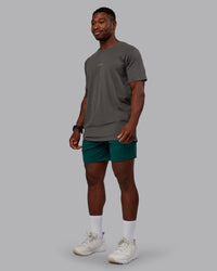 Man wearing Restore CloudFLX Short in Dark Moss | Size:M | Model:Sam | Thumbnail Index: 1