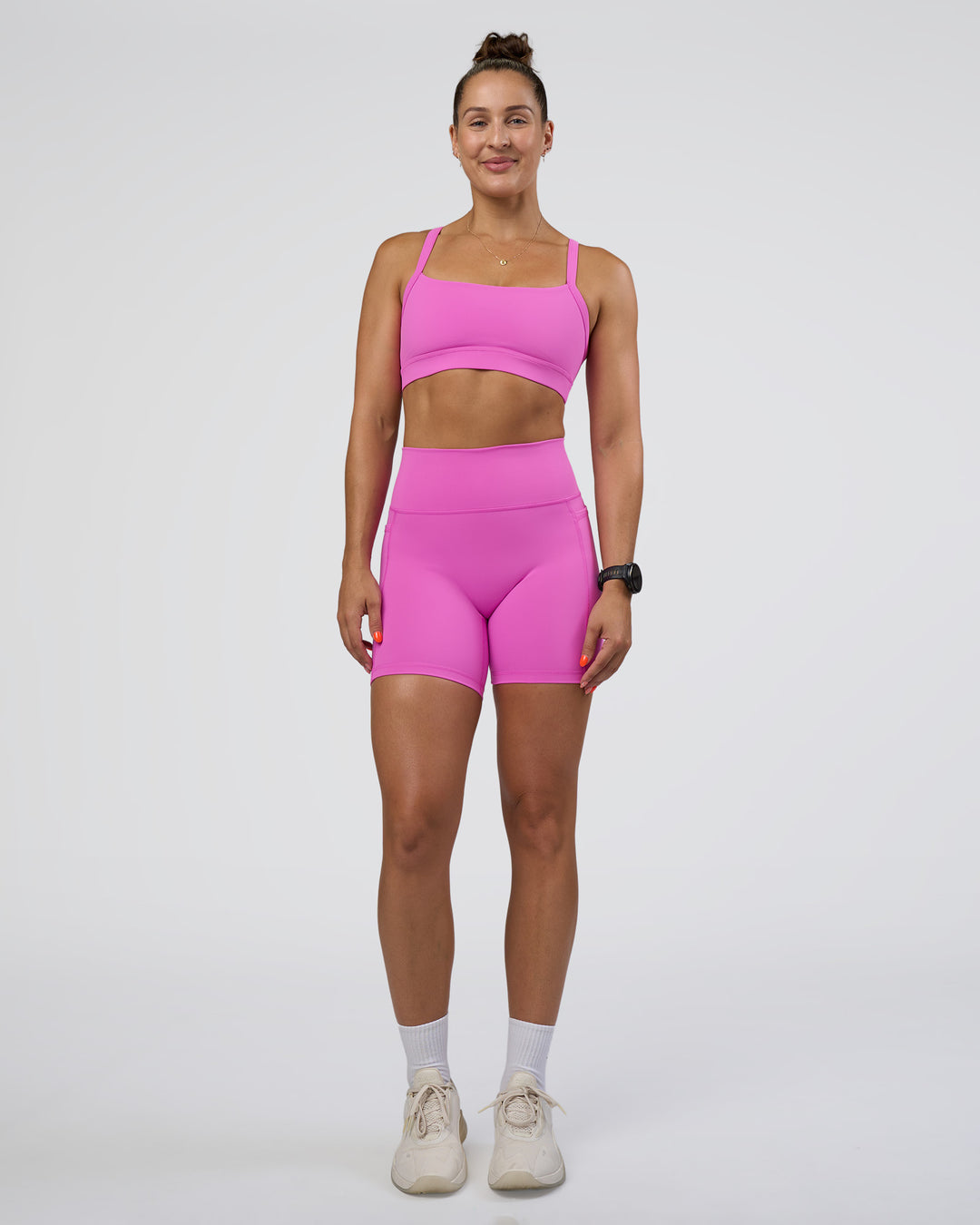Woman wearing Momentum Sports Bra - Ultra Fuchsia | Model:Abbey | Size:M - view 3