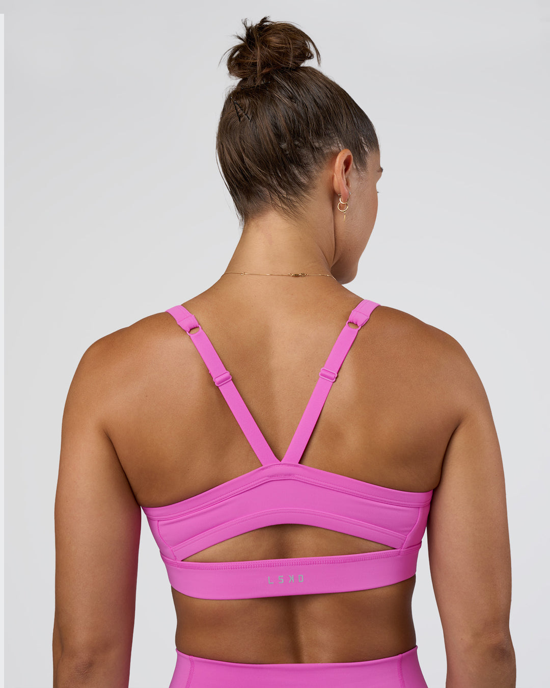 Woman wearing Momentum Sports Bra - Ultra Fuchsia | Model:Abbey | Size:M - view 6