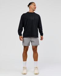 Man wearing Move Fast Heavyweight Oversized Long Sleeve Tee - Black Washed | Model:Jaiden | Size:M | Thumbnail Index: 3