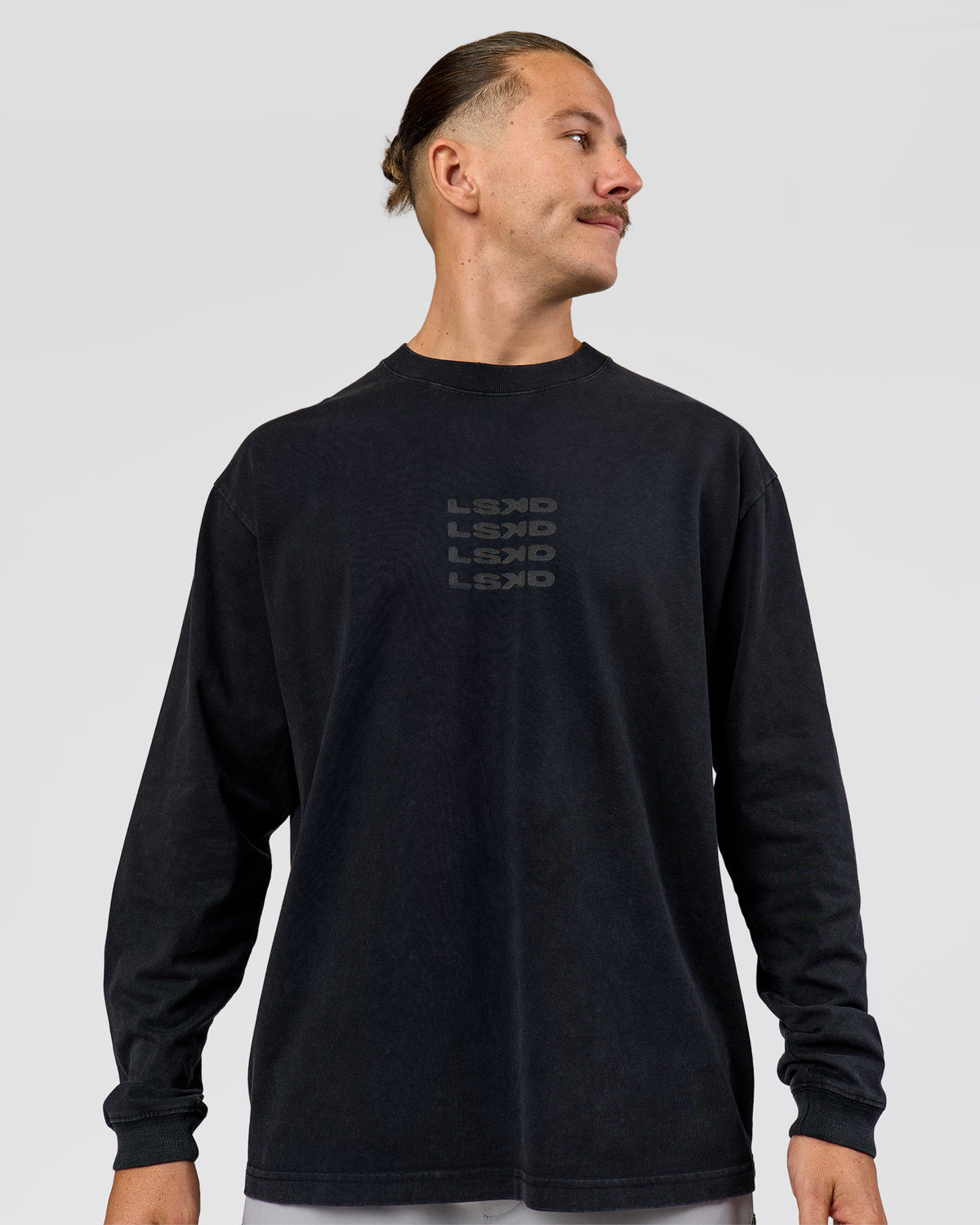 Man wearing Move Fast Heavyweight Oversized Long Sleeve Tee - Black Washed | Model:Jaiden | Size:M