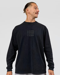 Man wearing Move Fast Heavyweight Oversized Long Sleeve Tee - Black Washed | Model:Jaiden | Size:M | Thumbnail Index: 0